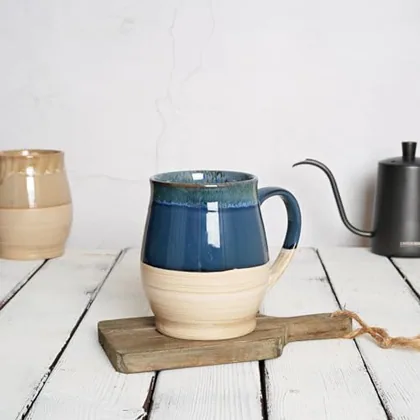 A Bosmarlin mug in a reactive glaze
