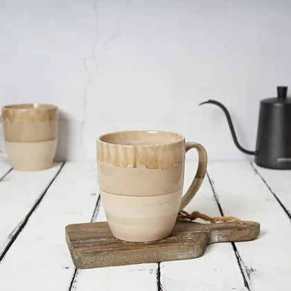 A Bosmarlin mug in a reactive glaze