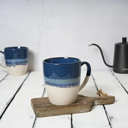 A Bosmarlin mug in a reactive glaze